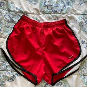 Red Nike shorts